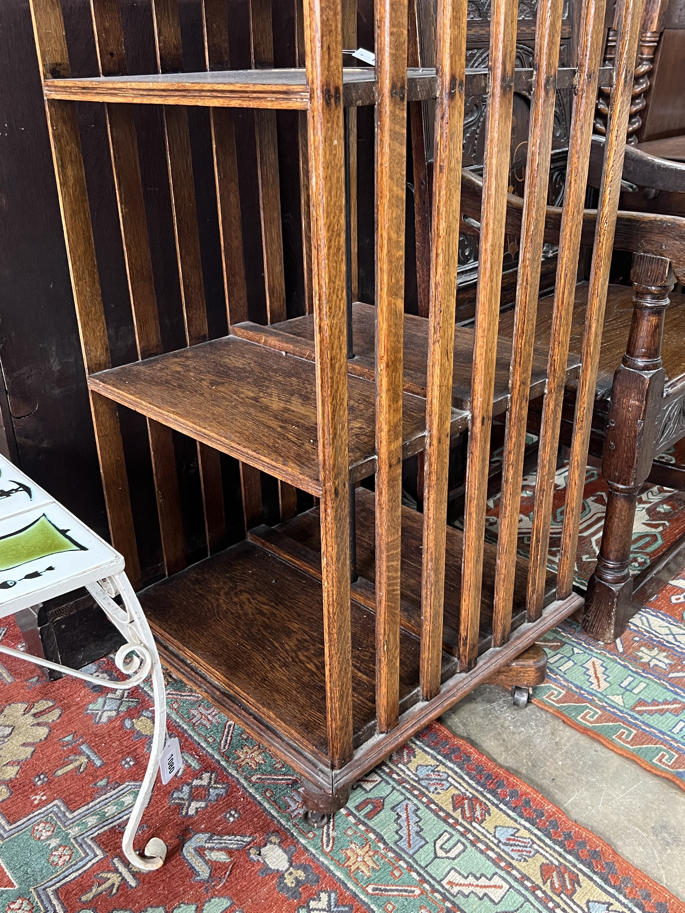 An early 20th century oak three tier revolving bookcase, width 51cm, depth 53cm, height 105cm